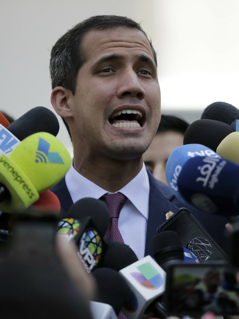Venezuelan opposition leader Juan Guaido, who has declared himself interim president, speaks to the press after a meeting with coalition of opposition parties, and other civic groups in Caracas, Venezuela, Monday, March 18, 2019. After Guaido declared himself interim president in late Feb., Venezuelan President Nicolas Maduro has remained in power despite heavy pressure from the United States and other countries arrayed against him, managing to retain the loyalty of most of his military leaders. (AP Photo/Natacha Pisarenko)