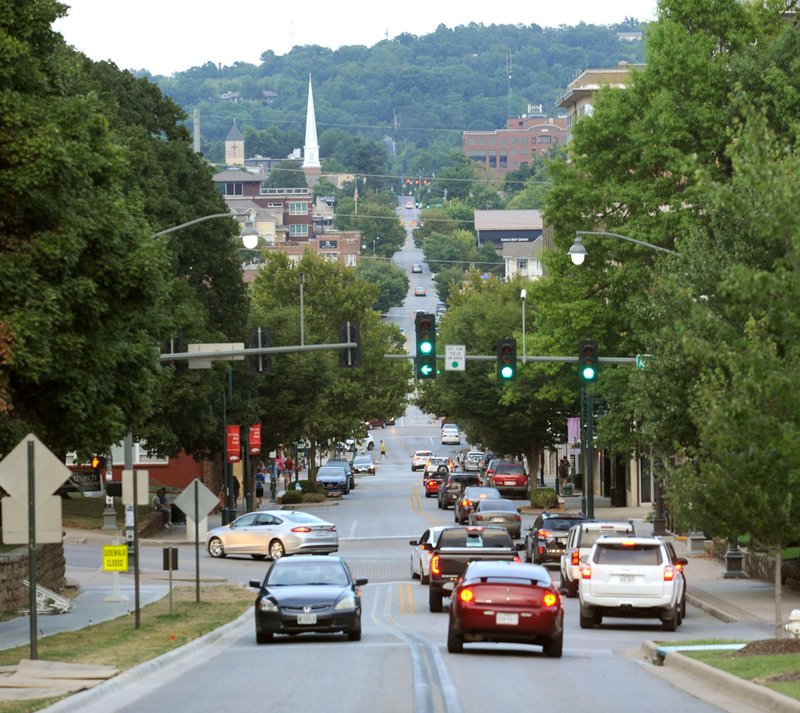 NWA Democrat-Gazette FILE PHOTO/ANDY SHUPE Traffic flows Tuesday, Aug. 30, 2016, on West Dickson Street in Fayetteville.