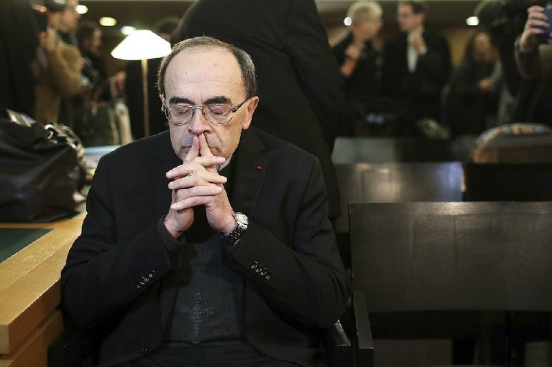 French Cardinal Philippe Barbarin waits for the start of his trial Jan. 7 at the courthouse in Lyon, France. He was convicted March 7 and received a six-month suspended sentence.