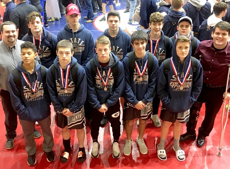 SUBMITTED Gentry wrestlers, along with Coach Madding, are pictured with their awards on Feb. 23.