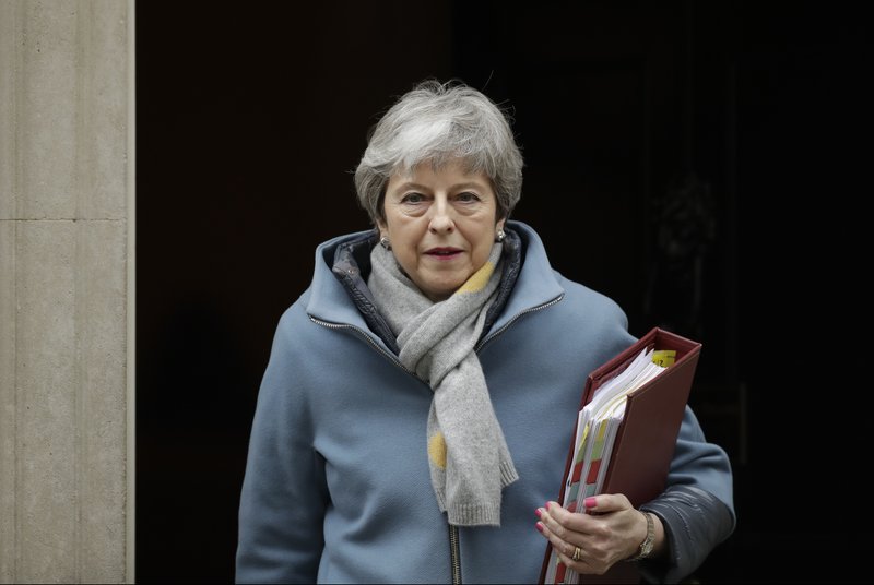 Britain's Prime Minister Theresa May leaves 10 Downing Street to attend the weekly Prime Ministers' Questions session, at parliament in London, Wednesday, March 20, 2019. (AP Photo/Matt Dunham)

