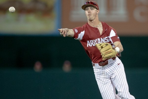 Arkansas infielder Casey Martin throws to first for an out against Texas during an NCAA college baseball game Wednesday, March 20, 2019, in Austin, Texas. (Nick Wagner/Austin American-Statesman via AP)