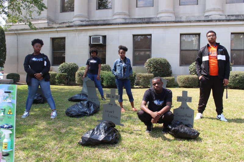 Demonstrate: Students from El Dorado High and Barton Junior High Schools’ eXtreme Youth Programs held an anti-smoking demonstration at the Union County Courthouse on Wednesday. The students designed a “graveyard” that showed the different diseases one can develop from smoking. Pictured from left to right are: Christen Morris, Trinity Caver, Kaitlynn Ford, Derodrick Harris and Rahiem Cain. Caitlan Butler/News-Times