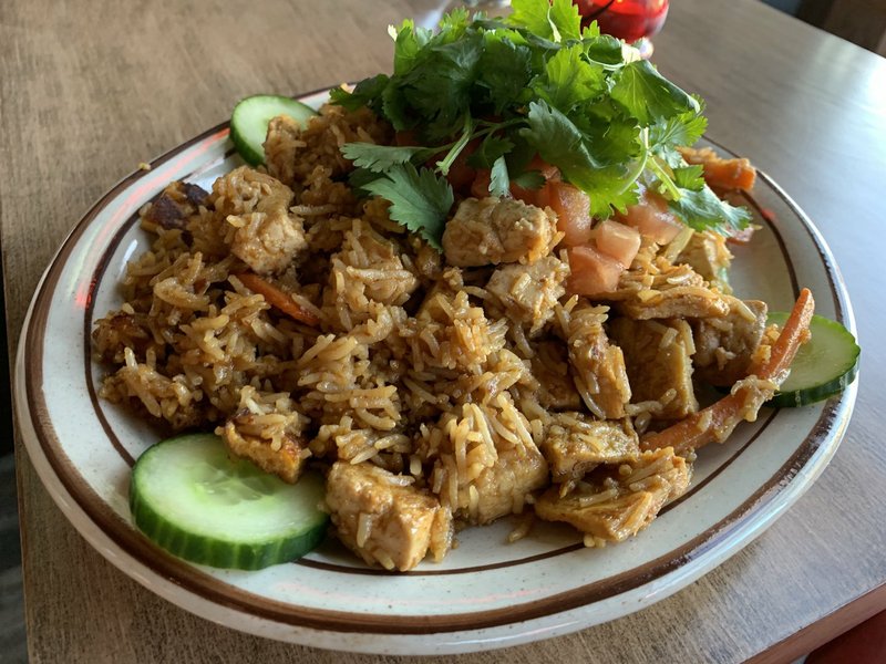 Nasi Goreng, an Indonesian fried rice dish, came with tofu instead of chicken, and got spicier as we approached the bottom of the plate. It’s one of the few original menu items available at Atlas Bar in Little Rock’s SoMA neighborhood. 