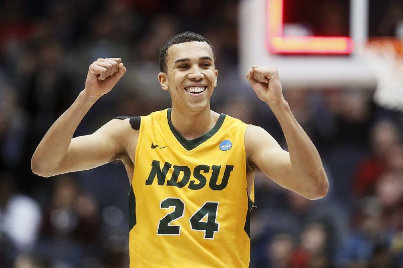 North Dakota State’s Tyson Ward (24) celebrates after the Bison’s 78-74 victory over North Carolina Central in the NCAA Tournament on Wednesday night in Dayton, Ohio. 