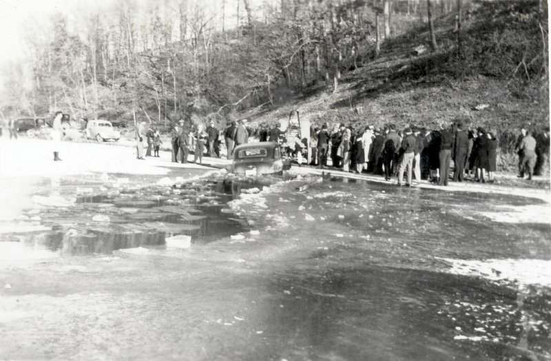 Photo by Sam Wood; courtesy Rogers Historical Museum C. Jimmy Carter retrieves his new Buick from the ice in Lake Atalanta in 1940. Hundreds of local citizens turned out to enjoy the entertainment.