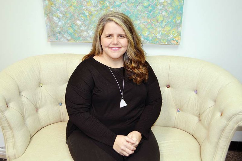 Breanne McLendon, the new executive director for the Women’s Shelter of Central Arkansas, sits in her office in Conway. McLendon worked with an organization that served homeless individuals, some of whom experienced domestic violence, before taking the position in January at the women’s shelter. McLendon said she wants to increase awareness that the program is not only a physical location, but it provides support groups and a sexual-assault program.