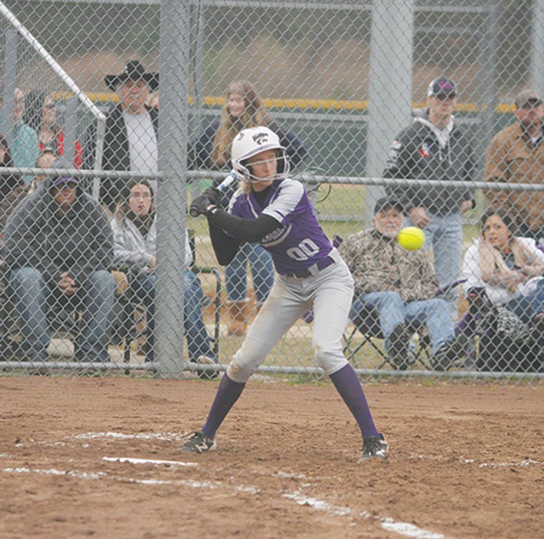 Terrance Armstard/News-Times El Dorado's Ava Dunn (00) watches a pitch during the Lady Wildcats' contest against Magnolia earlier this season. The Lady Wildcats are off to an 8-0 start, and will take on Camden Fairview to start play at the Magnolia Softball Tournament today.