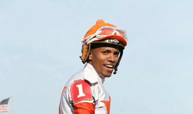 In this file photo Jockey Ricardo Santana Jr. smiles on Mitole after winning the Bachelor Stakes at Oaklawn Park Thursday April, 2018.
