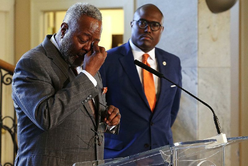 Keith Humphrey chokes up during a news conference Thursday at City Hall after Little Rock Mayor Frank Scott Jr. (right) announced that Humphrey would be the city’s new police chief.