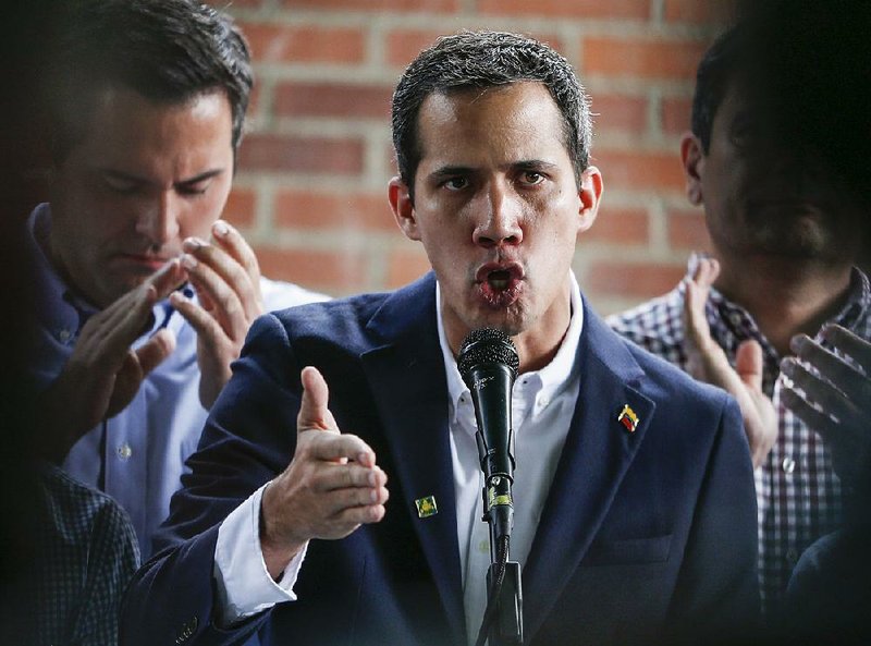 Venezuelan opposition leader Juan Guaido speaks out Thursday in Caracas after his top aide was detained in the middle of the night by masked agents who broke down his door in an operation against what officials said was a “terrorist” cell. Venezuelan President Nicolas Maduro said later in a national address that there could be more arrests related to a terrorist network. 