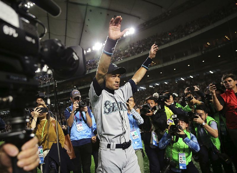 Seattle Mariners right fielder Ichiro Suzuki waves to fans after returning to the field after Thursday’s game against the Oakland Athletics at Tokyo Dome. The 45-year-old Mariners star announced his retirement after 19 seasons. 