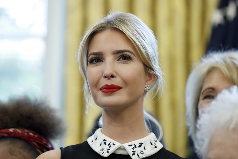 In this Sept. 25, 2017 file photo, Ivanka Trump stands by as President Donald Trump signs a memorandum to expand access to STEM, science technology engineering and math, education, in the Oval Office of the White House in Washington.