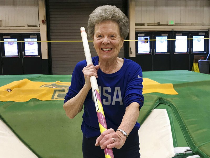 In this Thursday, March 13, 2019 photo, Florence "Flo" Filion Meiler, an 84-year-old record-setting pole vaulter, poses while training at the University of Vermont indoor track in Burlington, Vt. Meiler is headed to the world championships in Poland. She is competing in track and field events including the long jump, 60-meter hurdles, 800-meter run and pentathlon. But she's a shoo-in for the pole vault. (AP Photo/Lisa Rathke)
