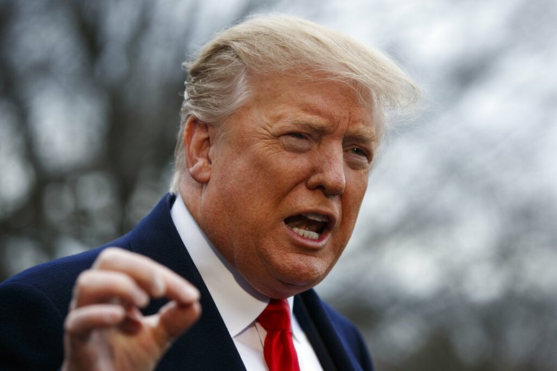 President Donald Trump talks with reporters before boarding Marine One on the South Lawn of the White House, Friday, March 22, 2019, in Washington. (AP Photo/Evan Vucci)