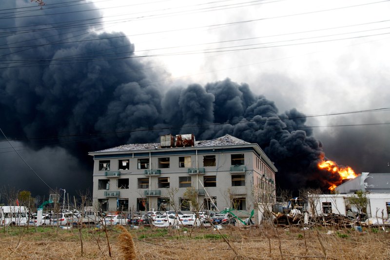 In this Thursday photo, fires burn at the site of a factory explosion in a chemical industrial park in Xiangshui County of Yancheng in eastern China's Jiangsu province. The local government reports the death toll in an explosion at a chemical plant in eastern China has risen with dozens killed and more seriously injured. (Chinatopix via AP)

