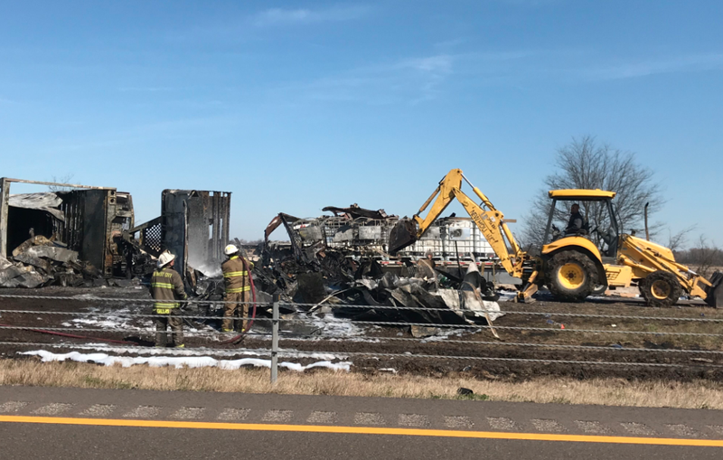 Crews work to clear wreckage from a fiery wreck along Interstate 40 in eastern Arkansas on Friday.