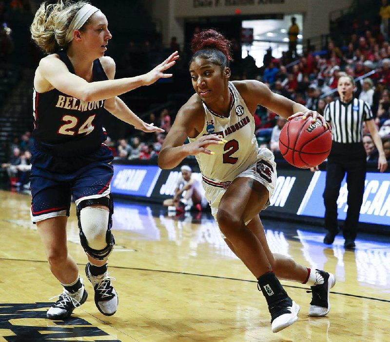 South Carolina guard Te’a Cooper (2) goes around Belmont’s Jenny Roy (24) for a basket in the Gamecocks’ 74-52 victory over Belmont on Friday in Charlotte, N.C.