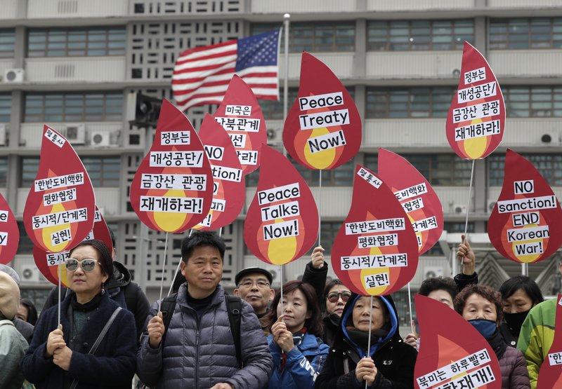 The Associated Press DEMANDING DENUCLEARIZATION: Protesters hold signs during a rally demanding the denuclearization of the Korean Peninsula and peace treaty near the U.S. embassy in Seoul, South Korea, Thursday. The Korean Peninsula remains in a technical state of war because the 1950-53 Korean War ended with an armistice, not a peace treaty. More than 20 protesters participated at the rally and also demanded the end the Korean War and to stop sanctions on North Korea. The letters read "Restarting operations at Kaesong industrial complex and Diamond Mountain resort."