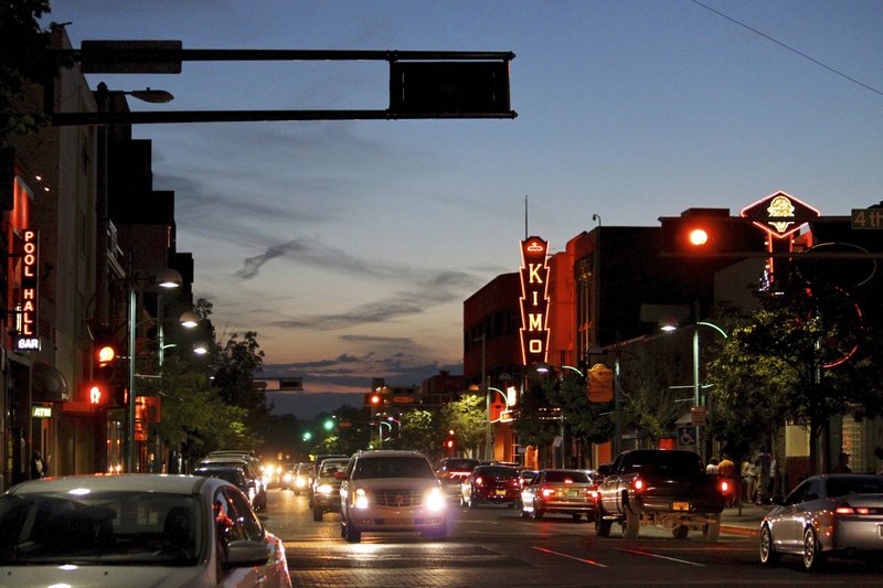 FILE - In this June 21, 2016, file photo, cars make their way along historic Route 66 in downtown Albuquerque, N.M. An endangered federal program that's helped preserve the historic Route 66 Highway for two decades is issuing its last call for grants in April 2019. At risk are millions of dollars in grants aimed at reviving old tourist spots in struggling towns. (AP Photo/Susan Montoya Bryan, File)