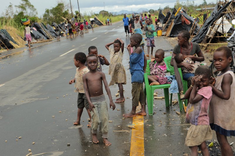 Survivors of Cyclone Idai in a makeshift shelter by the roadside near Nhamatanda about 50 kilometres from Beira, in Mozambique, Friday March, 22, 2019. As flood waters began to recede in parts of Mozambique on Friday, fears rose that the death toll could soar as bodies are revealed. (AP Photo/Tsvangirayi Mukwazhi)