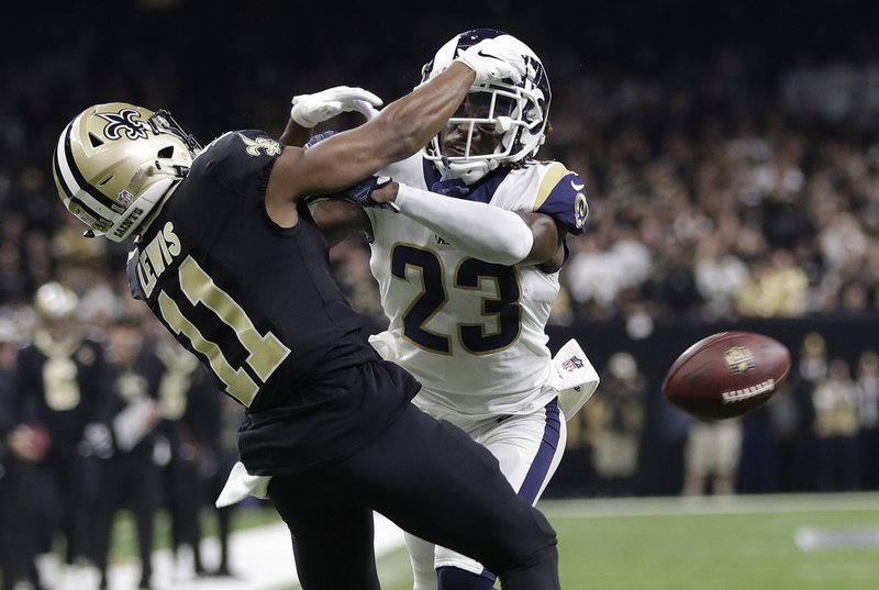 FILE - In this Jan. 20, 2019, file photo, Los Angeles Rams' Nickell Robey-Coleman breaks up a pass intended for New Orleans Saints' Tommylee Lewis during the second half of the NFL football NFC championship game in New Orleans. Reviewing penalty calls, including pass interference, will be among proposals NFL owners will hear to expand the use of replay when they meet next week in Phoenix. Expanding replay has become a scorching topic since the NFC championship game, when a non-call on a blatant pass interference and helmet-to-helmet hit by Rams defensive back Nickell Robey-Coleman likely cost the Saints a trip to the Super Bowl. (AP Photo/Gerald Herbert, File)