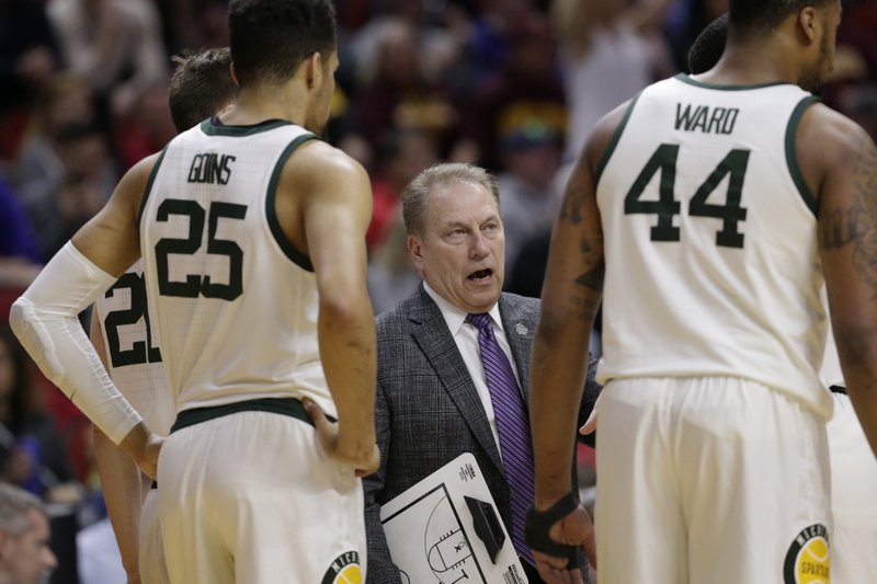 The Associated Press TIMEOUT TALK: Michigan State coach Tom Izzo, center, talks to his players during a timeout in the first half of a first round men's college basketball game against Bradley in the NCAA Tournament in Des Moines, Iowa, Thursday.