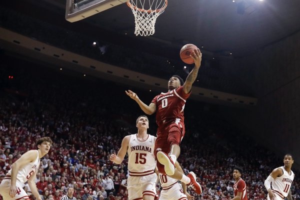 Arkansas's Desi Sills (0) puts up a shot against Indiana's Zach McRoberts (15) during the first half in the second round of the NIT college basketball tournament, Saturday, March 23, 2019, in Bloomington, Ind. (AP Photo/Darron Cummings)