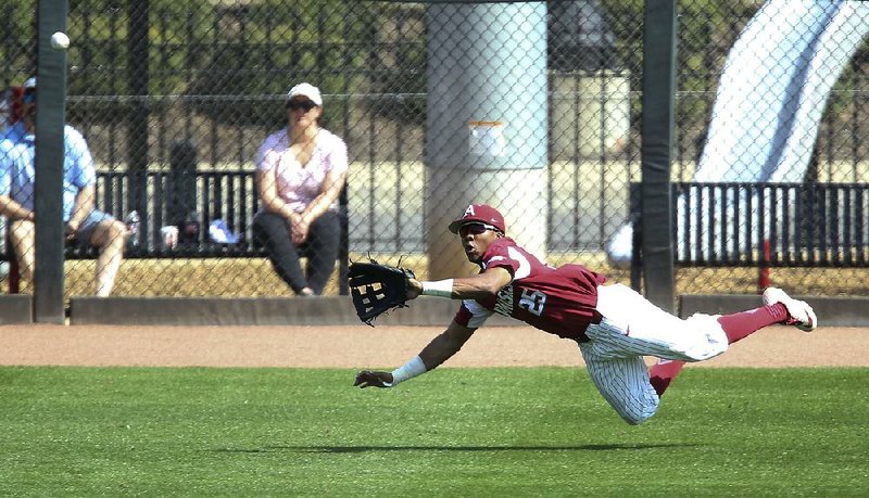 Arkansas left fielder Christian Franklin dives to make a catch during the Razorbacks’ loss to Alabama on Saturday at Sewell-Thomas Stadium in Tuscaloosa, Ala. The third and final game of the series is today at 1 p.m. Central. 