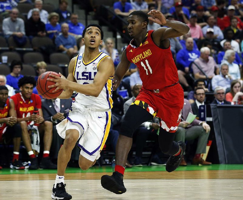 LSU guard Tremont Waters (left) hit a layup with 1.6 seconds remaining Saturday to give the Tigers a 69-67 victory over Maryland in Jacksonville, Fla. 