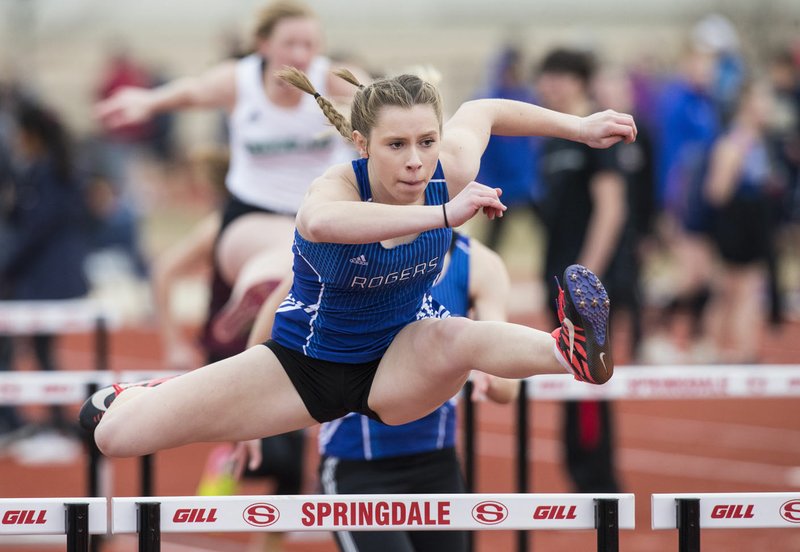 NWA Democrat-Gazette/BEN GOFF @NWABENGOFF Georgia Brain of Rogers was forced to quit gymnastics because of an injury, but she's turned into a track standout in the jumps and hurdles for the Lady Mounties.