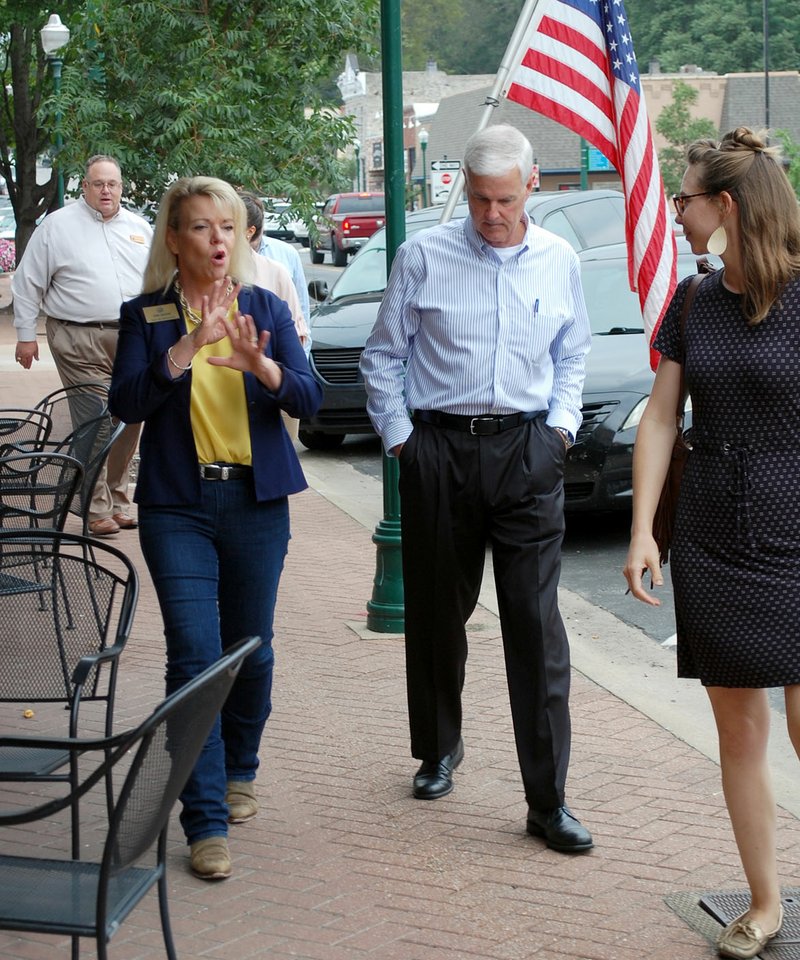 File photo State Rep. Robin Lundstrum (R-Elm Springs) (left),walked with U.S. Rep. Steve Womack (R-AR) in downtown Siloam Springs in August of last year while the two toured some small businesses in the area, such as Heather Hill Clothing or Blogs for Brands. The tour was facilitated with the help of Main Street Siloam Springs and was an opportunity for Lundstrum to show Womack different areas of the local economy that have improved.