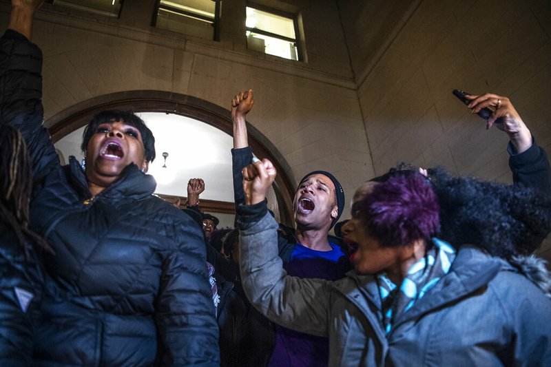 People, including Khalil Darden, 18, of Penn Hills, Pa., center, and Pennsylvania State Rep. Summer Lee, right, protest after they learned a not guilty verdict in the homicide trial of former East Pittsburgh police Officer Michael Rosfeld, Friday, March 22, 2019, at the Allegheny County Courthouse in downtown Pittsburgh, Pa. A jury acquitted Rosfeld, a former police officer Friday in the fatal shooting of Antwon Rose II, an unarmed teenager as he was fleeing a high-stakes traffic stop outside Pittsburgh, a confrontation that was captured on video and led to weeks of unrest. (Alexandra Wimley/Pittsburgh Post-Gazette via AP)