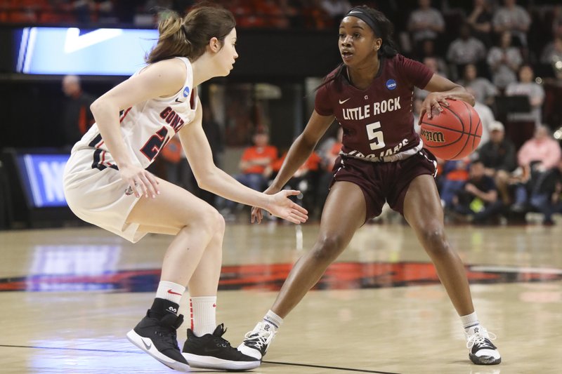 The Associated Press GET PAST: Little Rock's Tori Lasker (5) tries to get past Gonzaga's Katie Campbell (24) during the first half of a first-round game of the NCAA women's college basketball tournament in Corvallis, Ore., Saturday.