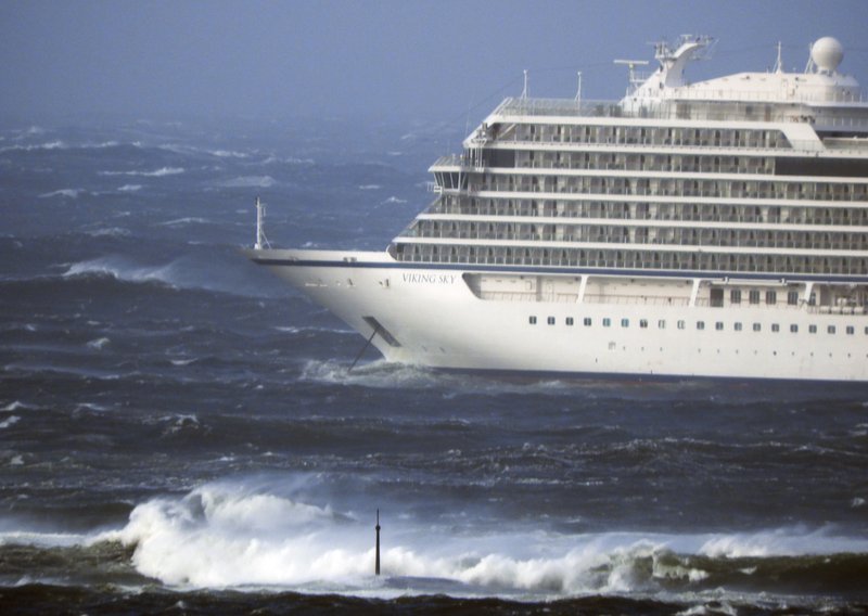 HEAVY SEAS: The cruise ship Viking Sky lays at anchor in heavy seas, after it sent out a Mayday signal because of engine failure in windy conditions, near Hustadvika, off the west coast of Norway, Saturday. The Viking Sky is forced to evacuate its 1,300 passengers.