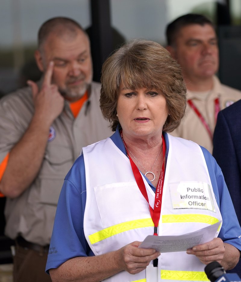 Intercontinental Terminals Company public information officer Alice Richardson reads a statement during a news conference Saturday, March 23, 2019, in Pasadena, Texas. The efforts to clean up the Texas industrial plant that burned for several days this week were hamstrung Friday by a briefly reignited fire and a breach that led to chemicals spilling into the nearby Houston Ship Channel. (AP Photo/David J. Phillip)
