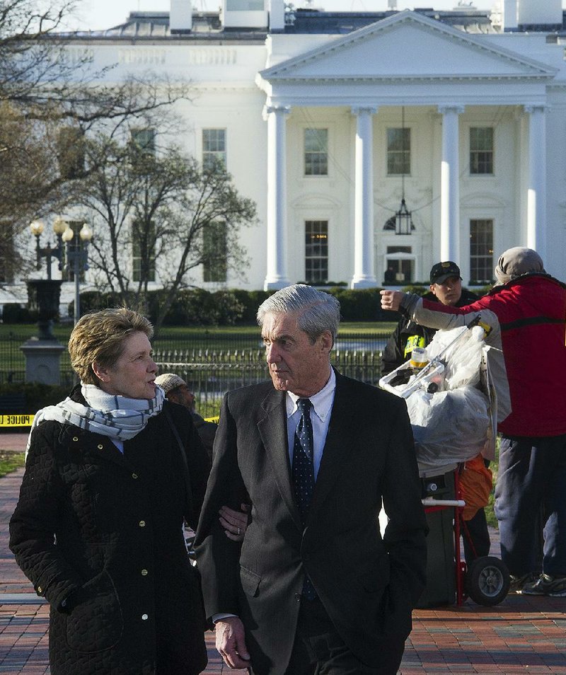 Special counsel Robert Mueller and his wife, Ann, walk past the White House after attending morning services Sunday at St. John’s Episcopal Church in Washington. 