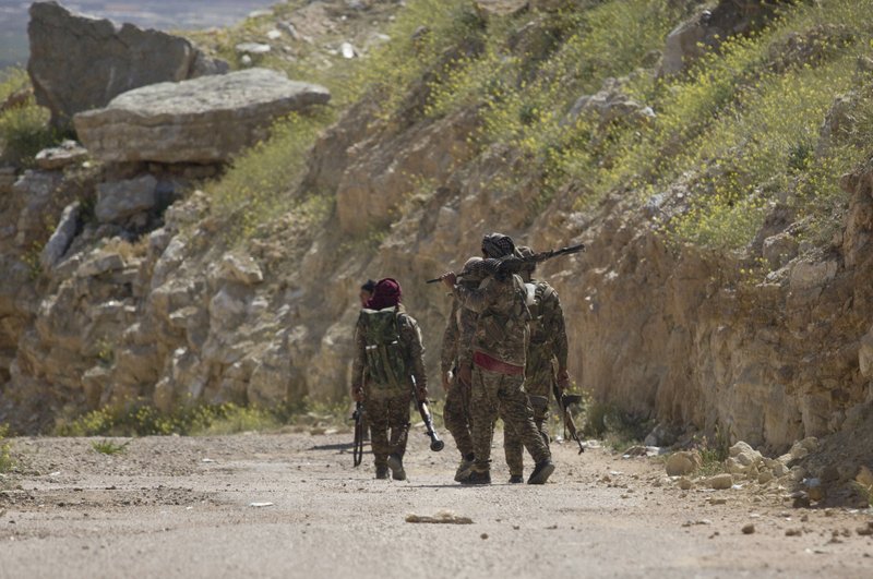 The Associated Press OPERATION: A column of smoke from operations by U.S.-backed Syrian Democratic Forces (SDF) head out on an operation in Baghouz, the Islamic State group's last pocket of territory in Syria, Wednesday.