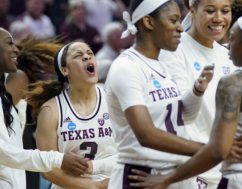 The Associated Press SECOND ROUND WIN: Texas A&amp;M's Chennedy Carter (3) celebrates with teammates after a second round women's college basketball game against Marquette in the NCAA Tournament Sunday, in College Station, Texas. Texas A&amp;M won 78-76.