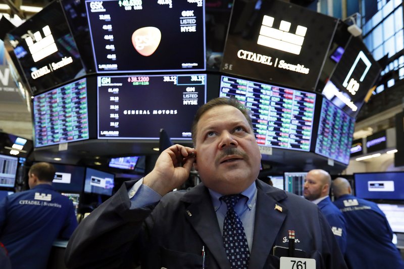 FILE- In this March 18, 2019, file photo trader John Santiago works on the floor of the New York Stock Exchange. U.S. stocks edged lower in early trading Monday, March 25, extending losses from a broad sell-off last week, as new economic data stoked investors' worries over slowing global growth. (AP Photo/Richard Drew, File)