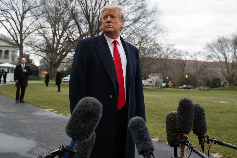 President Donald Trump listens to a question as he speaks with reporters before boarding Marine One on the South Lawn of the White House, Friday, March 22, 2019, in Washington. (AP Photo/Evan Vucci)

