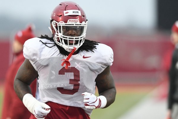 Arkansas defensive lineman McTelvin Agim goes through practice Thursday, March 9, 2019, in Fayetteville.