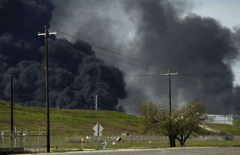 The petrochemical fire at Intercontinental Terminals Company reignited as crews tried to clean out the chemicals that remained in the tanks Friday, March 22, 2019, in Deer Park, Texas. The efforts to clean up a Texas industrial plant that burned for several days this week were hamstrung Friday by a briefly reignited fire and a breach that led to chemicals spilling into the nearby Houston Ship Channel. (Godofredo A. Vasquez/Houston Chronicle via AP)