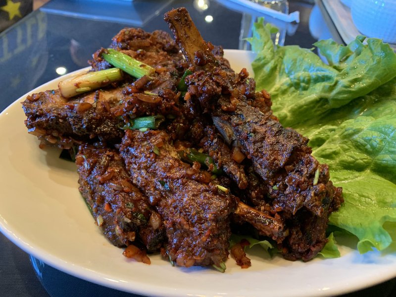 Schezwan Pepper Ribs are plenty as an appetizer for two, or even three, at Asian Bar & Grill on Cantrell Road. Arkansas Democrat-Gazette/Eric E. Harrison
