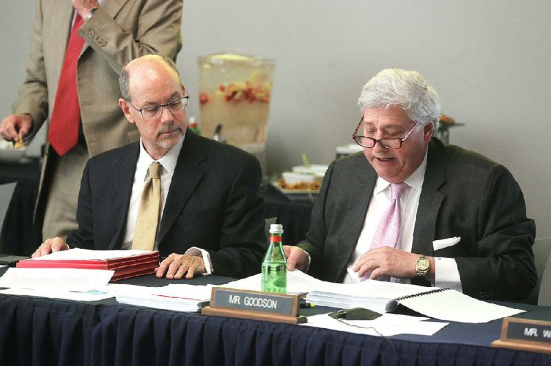 Donald Bobbitt (left), president of  the University of Arkansas System,  listens as John Goodson, chairman of the University of Arkansas board of trustees, speaks during Wednesday’s meeting in  Hot Springs.