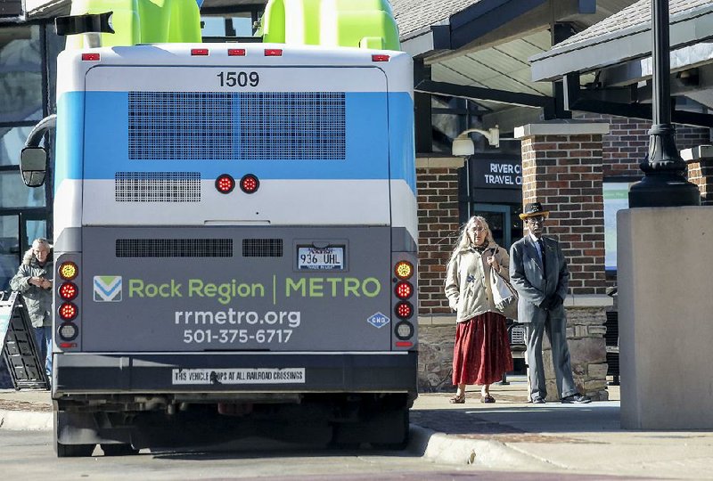 In this file photo passengers wait for their Rock Region Metro bus at the River Cities Travel Center in downtown Little Rock.