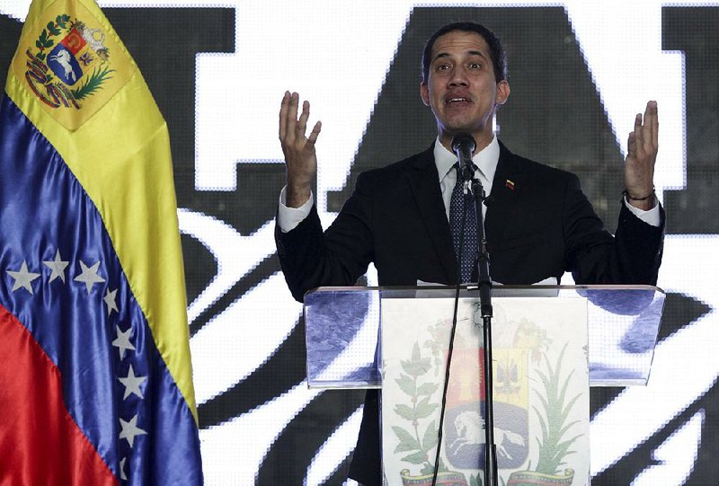 Venezuela’s self-proclaimed interim President Juan Guaido speaks Thursday during a meeting with electricity experts in Caracas.