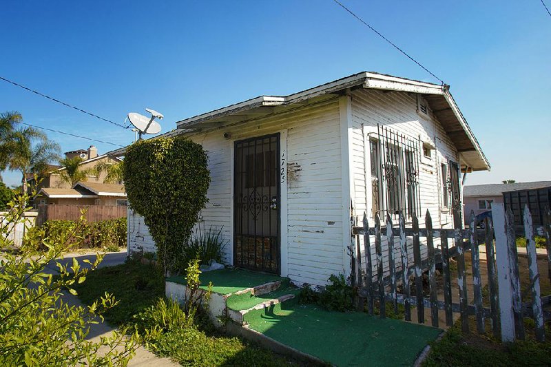 This 500-square-feet home on L Avenue in National City, Calif., is listed for sale for $250,000. The inside of the home has been gutted down to the studs. 