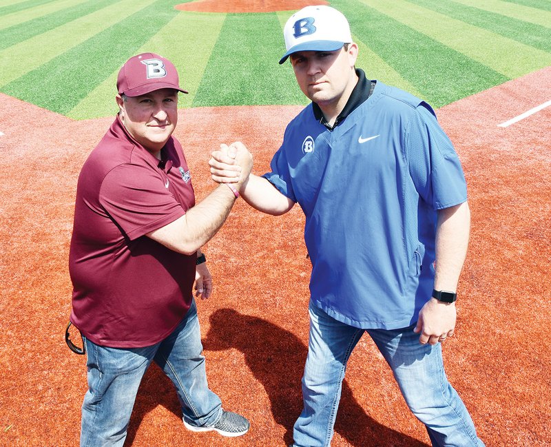Benton High School baseball coach Mark Balisterri, left, and Bryant High School baseball coach Travis Queck meet at home plate at the new Everett Field at the Benton Schools Athletic Complex. The two teams will face each other in the first-ever Big Red Series on Saturday. Tailgating for the game will begin at 3 p.m., with the actual game slated to start at 5:30 p.m.