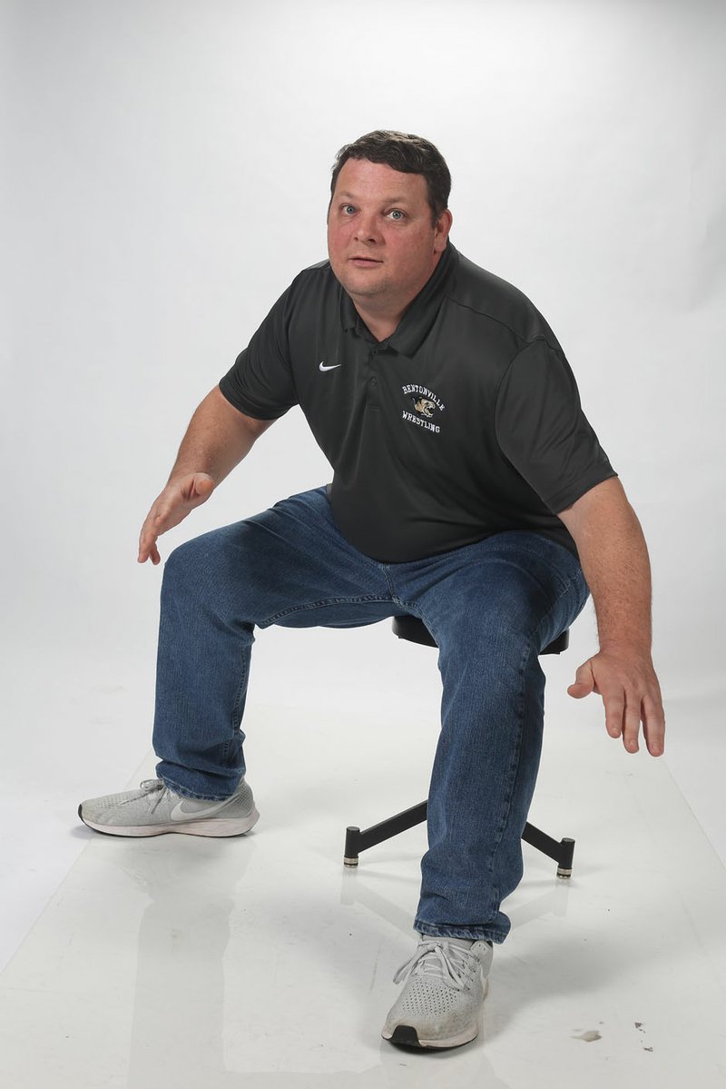 NWA Democrat-Gazette/DAVID GOTTSCHALK Bentonville High's Jason Adams has been named the All NWADG wrestling Coach of the Year. He led the Tigers to the Class 6A state team title.